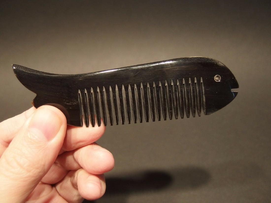Black Horn, Fish shaped Small Beard Comb anti static: 4 5/8" Long x 1 1/4" Wide Nice reproduction of a horn comb. Horn combs are said to absorb oils, and don't create static electricity! Reserve: $10.00 Shipping: Domestic: Flat-rate of $6.00 to anywhere 