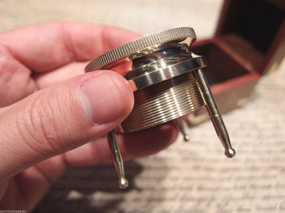 Brass Chart Map Glass Magnifying Desk Lens Magnifier w: Glass is 1 7/8" Wide x 2" High,.. adjustable to 2 1/2" box is 2 3/4" x 2 3/4" x 2 3/4" Nice reproduction of an antique magnifying lens. Nice heavy quality thick glass. This piece slides along the surf