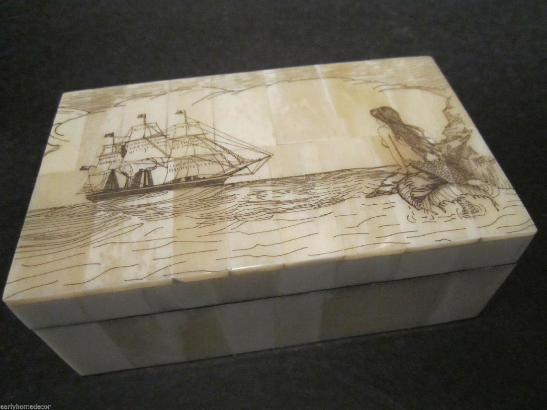 Folk Art Mermaid Scrimshaw Etched Bone & Wood Trinket: 6 3/8" Long x 3 7/8" Wide x 1 5/8" High Wonderful new reproduction scrimshaw carved ox bone box. As you can see this piece is tiled with bone on wood and decorated with a design typical of the period.