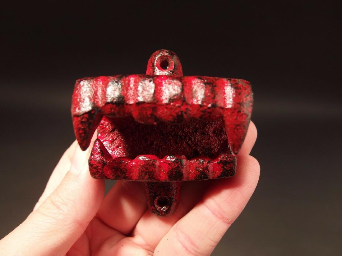 Cast Iron Red Vampire Dracula Teeth Beer Bottle Opener: 2 3/8" Wide 3" Tall Wonderful reproduction red cast iron vampire teeth bottle opener. New made to look just like the original all cast iron with red distressed paint. Such a neat heavy duty collectibl