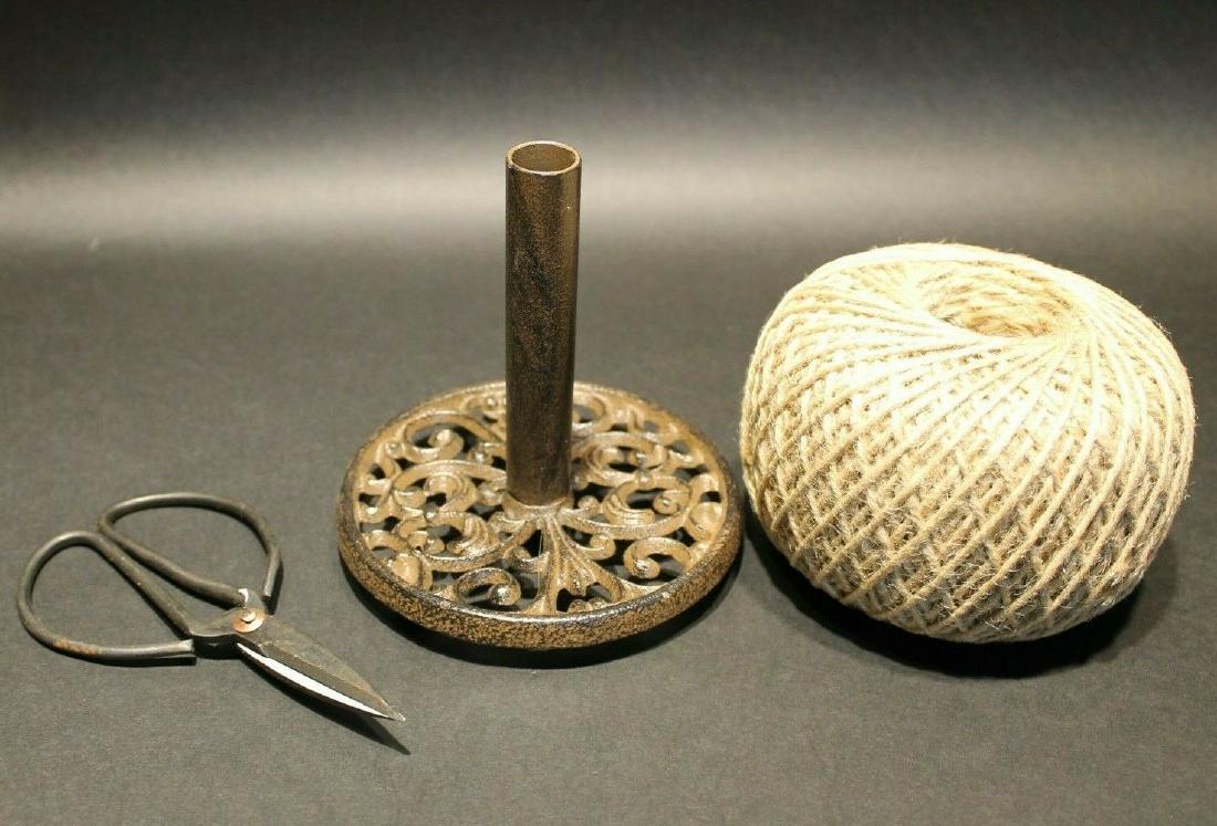Cast Iron Twine String Spool Holder w Scissors: 5 1/4" Tall x 5" Wide 6" Long Scissors Well made functional reproduction cast iron spool holder, iron scissors, roll of twine. Great for use or display. Comes in handy for any garden or shop. Reserve: