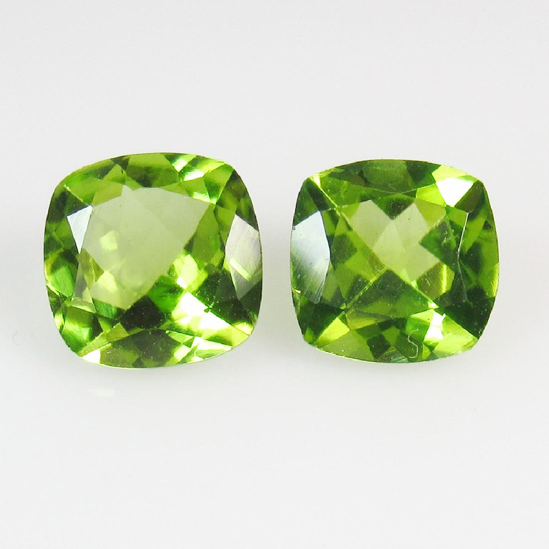 3.13 Ct Genuine Pakistan Peridot 7X7 mm Cushion Pair: No Reserve! Title: 3.13 Ct Genuine Pakistan Peridot 7X7 mm Cushion Pair Stone Clarity: VVS Gemstones: Natural Peridot Carat Weights: 3.13 Size/Dimensions: 7.00 x 7.00 x 4.50 mm / 2 PC's Additional Inf