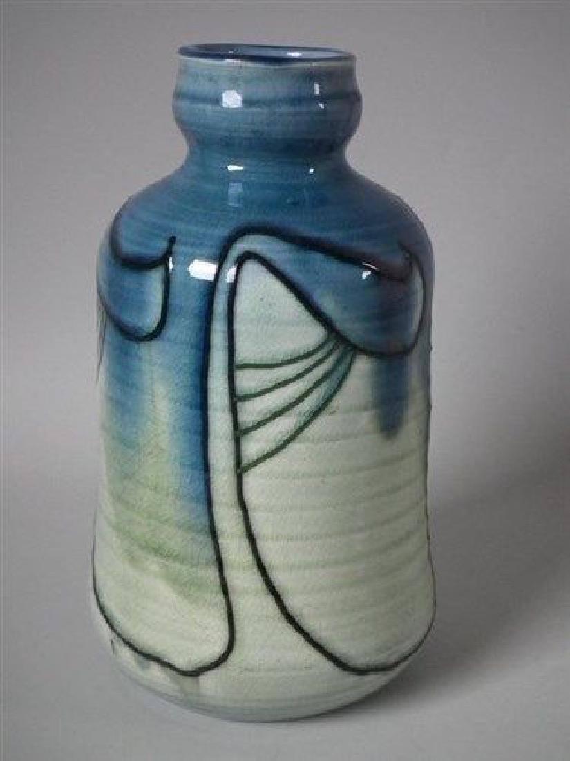 Minton Secessionist vase: Title: Minton Secessionist vase Description: Minton Secessionist vase Description Minton Secessionist vase decorated with black and green tube lining, on a blue and green ground. Ribbed effect to body
