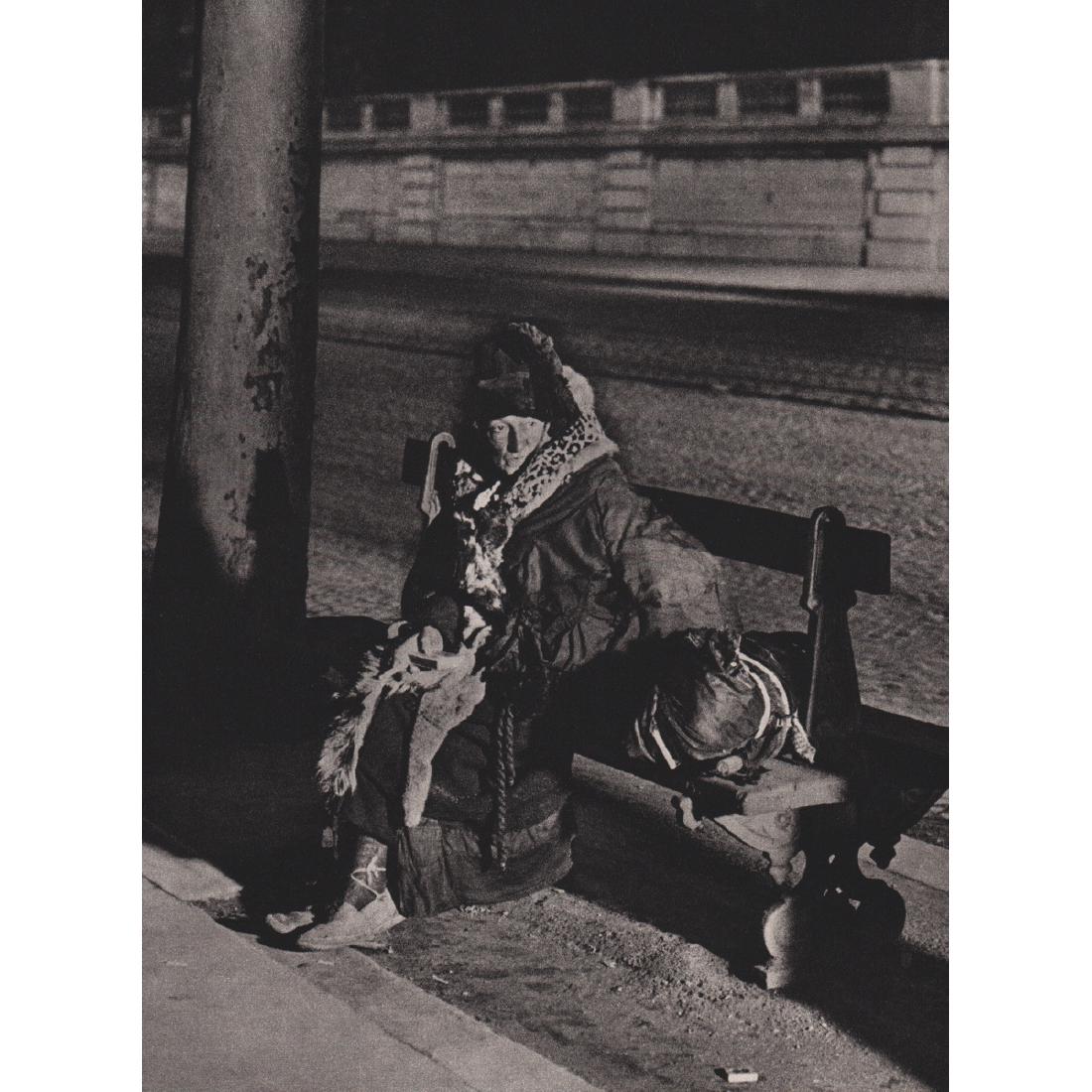 BRASSAI - A Spectral Beggarwoman: Artist: BRASSAI Print Title: A Spectral Beggarwoman Medium: Sheet-fed Gravure Printing Date: 1980's Printed in France Image size approx. 7 X 9.5 inches Brassai was a Hungarian–French photographer, s