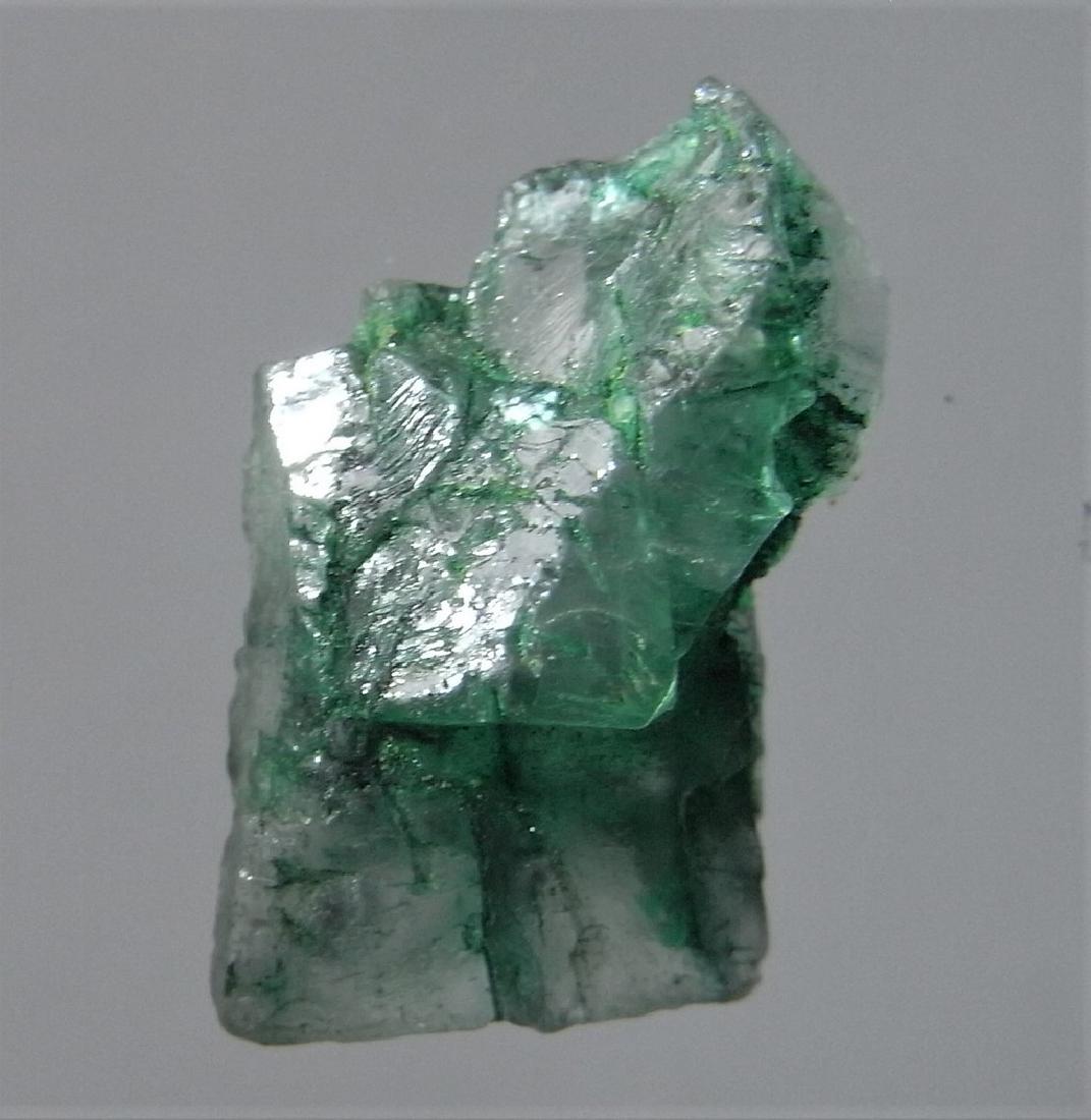 4.5 CT TRANSLUCENT EMERALD - UNTREATED GEMSTONE: Title: 4.5 CT TRANSLUCENT EMERALD - UNTREATED GEMSTONE Origin: Chivor Mine, Bayaco Dist. Colombia Size: 1.74x1x0.55 cm / 0.9 gram Additional Information: translucent, dark green emerald with crystalli
