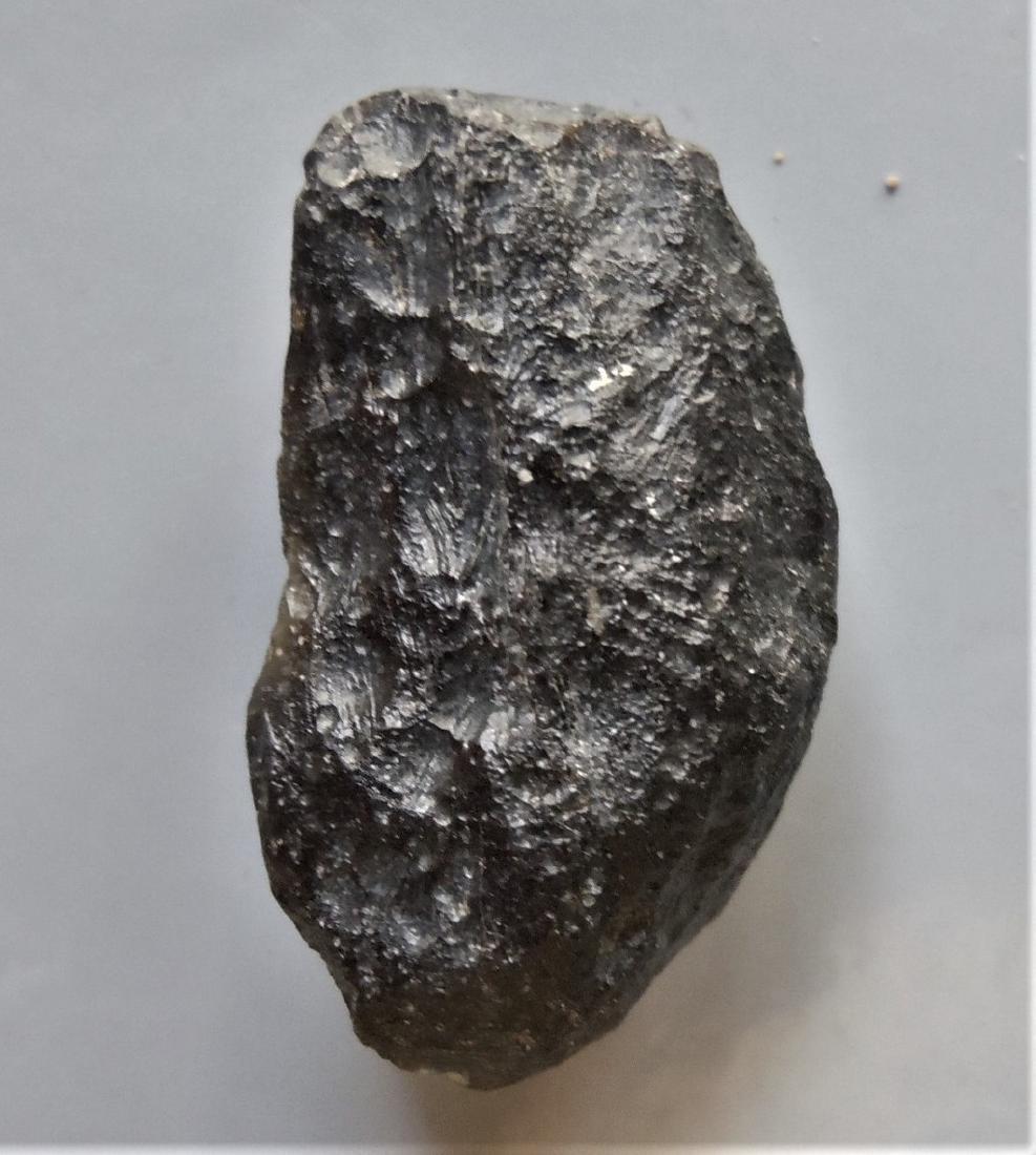 THAILANDITE TEKTITE - FROM METEORITE IMPACT: Title: THAILANDITE TEKTITE - FROM METEORITE IMPACT Origin: Noen Sa-Nga, Chaiyaphum Prov. Thailand Size: 2.25x1.3x1 cm / 3 gram Additional Information: elongate and irregular shaped thailandite tektite