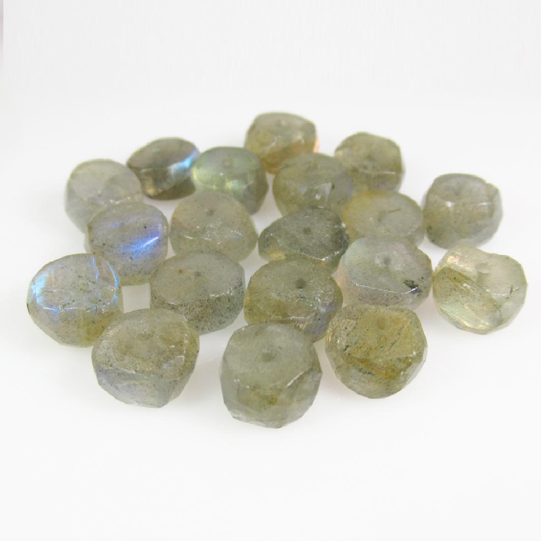 44.24 Ctw Natural 19 Labradorite Drilled Round Beads: No Reserve! Title: 44.24 Ctw Natural 19 Labradorite Drilled Round Beads Stone Clarity: Transparent Gemstones: Labradorite Carat Weights: 44.24 Size/Dimensions: 7.50 to 7.80 mm / 19 PC's Additional Inf