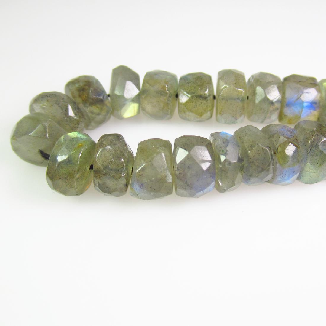 48.53 Ctw Natural 21 Labradorite Drilled Round Beads: No Reserve! Title: 48.53 Ctw Natural 21 Labradorite Drilled Round Beads Stone Clarity: Transparent Gemstones: Labradorite Carat Weights: 48.53 Size/Dimensions: 8.00 to 8.30 mm / 21 PC's Additional Inf