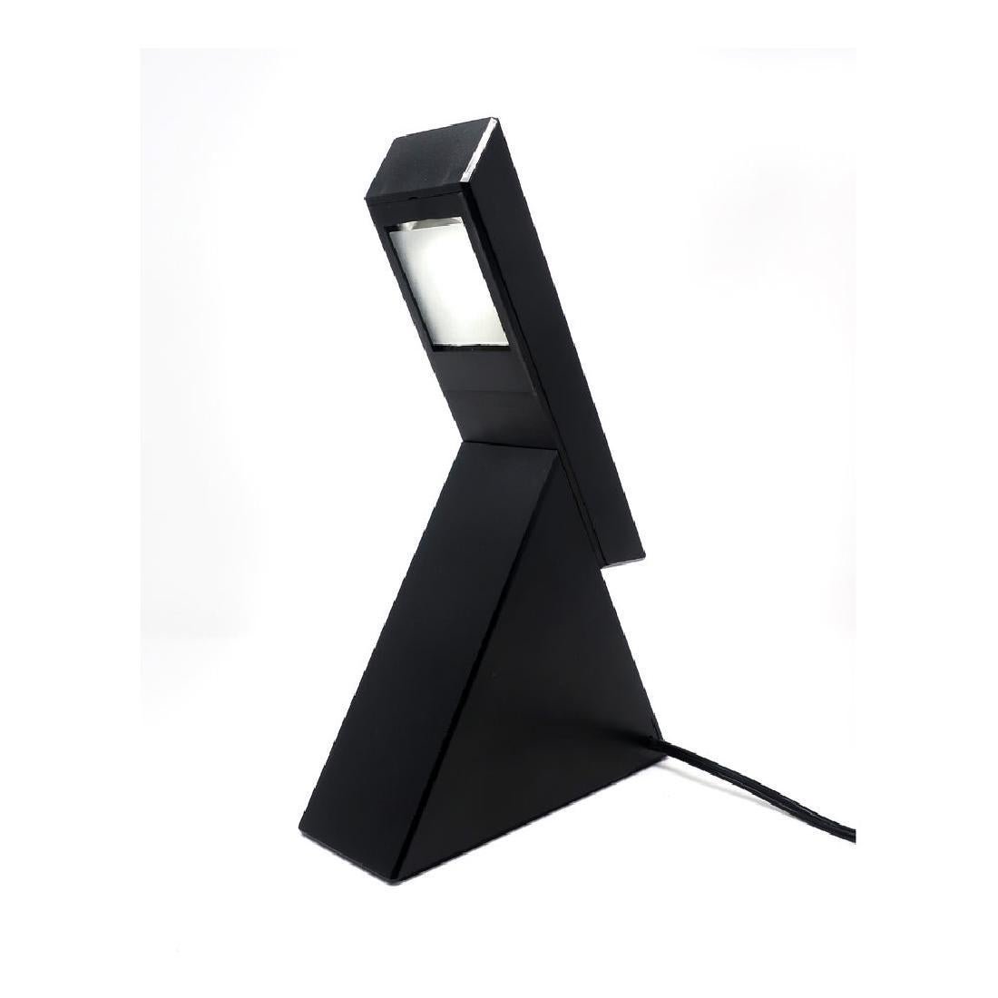 Italian Postmodern Delta Lamp by Mario Bertorelle for: A geometric Postmodern table lamp designed by Mario Bertorelle for JM RDM Massanzago Italy. Lamp turns on by sliding the switch up to expose the bulb. It has 2 intensities, one low and one brighter wh