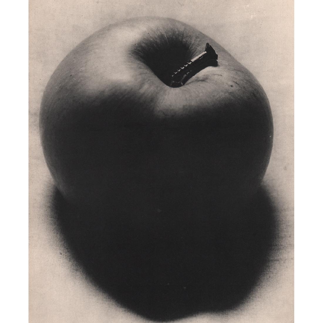 MAN RAY - Apple: Artist: MAN RAY Print Title: Apple Medium: Sheet-fed Gravure Printing Date: 1930's Printed in France Image size approx. 8.5 x 10.5 inches Man Ray, original name Emmanuel Radnitzky, was born on August