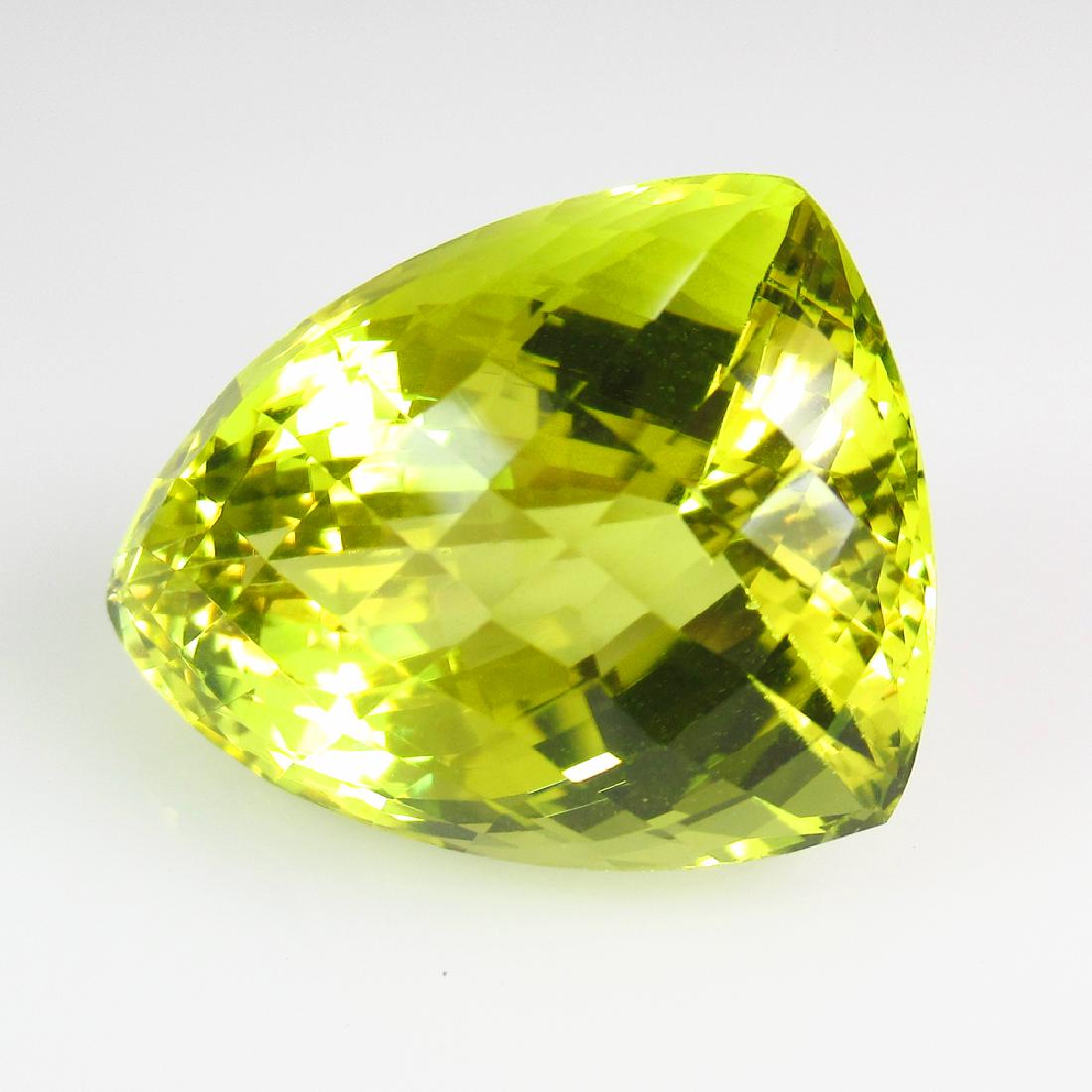 27.47 Ct Natural Lemon Quartz 22X16.5 mm Fancy Cut: No Reserve! Title: 27.47 Ct Natural Lemon Quartz 22X16.5 mm Fancy Cut Stone Clarity: VVS Gemstones: Natuarl Lemon Quartz Carat Weights: 27.47 Size/Dimensions: 17.00 x 10.60 x 7.40 mm Additional Inform