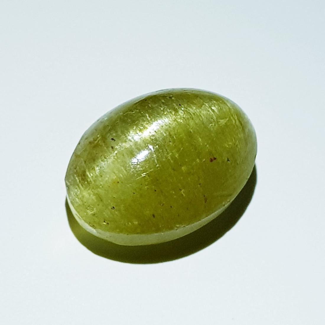 11.35 ct Natural Apatite cat's Eye: No Reserve! Title: 11.35 ct Natural Apatite cat's Eye Color/Clarity: Semi Transparent Gemstones: Loosegemstone Carat Weights: 11.35 Size/Dimensions: 15.40 x 11.00 x 8.40 Additional Information: Oval -