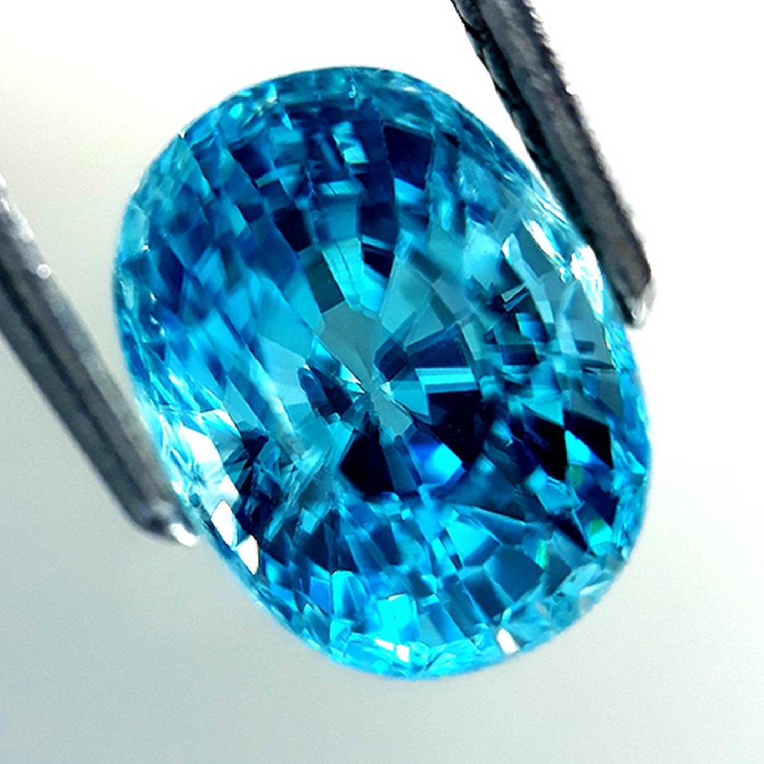 5.70 Cts Natural Blue Zircon: Title: 5.70 Cts Natural Blue Zircon Color/Clarity: Blue/VS1 Gemstone Type: Zircon Carat Weights: 5.70 Cts 9.68 x 7.30 x H7.27 mm Reserve: $400.00 Shipping: Domestic: Flat-rate of $20.00 to anywhere w