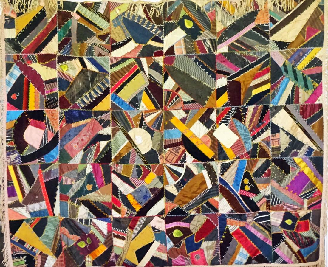 Victorian Crazy Quilt: Title: Victorian Crazy Quilt Dimension: 61 x 70 inches Provenance:Fascinating decorative stitching throughout holding 100's of silk dressmaker's scraps. damasks, brocades, silks together (about 6 have