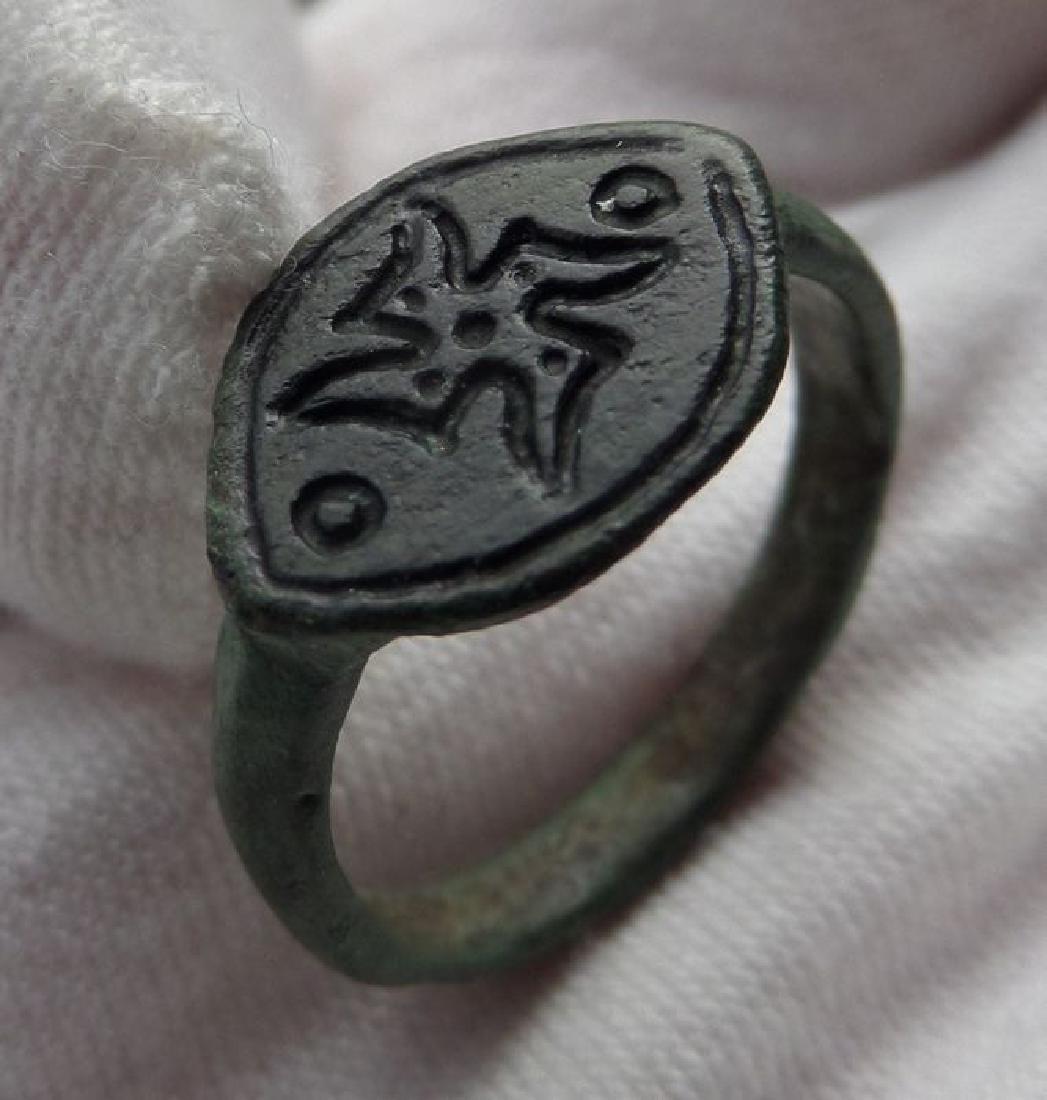 Early medieval Bronze Viking ring with Rune Swastika ?: Title: Early medieval Bronze Viking ring with Rune Swastika ? Origin: U.K. Private collection Date: Viking period, 8-11th century AD Materials: Bronze Dimensions: overall: 22 x 21 mm, ringsize: 19 mm 