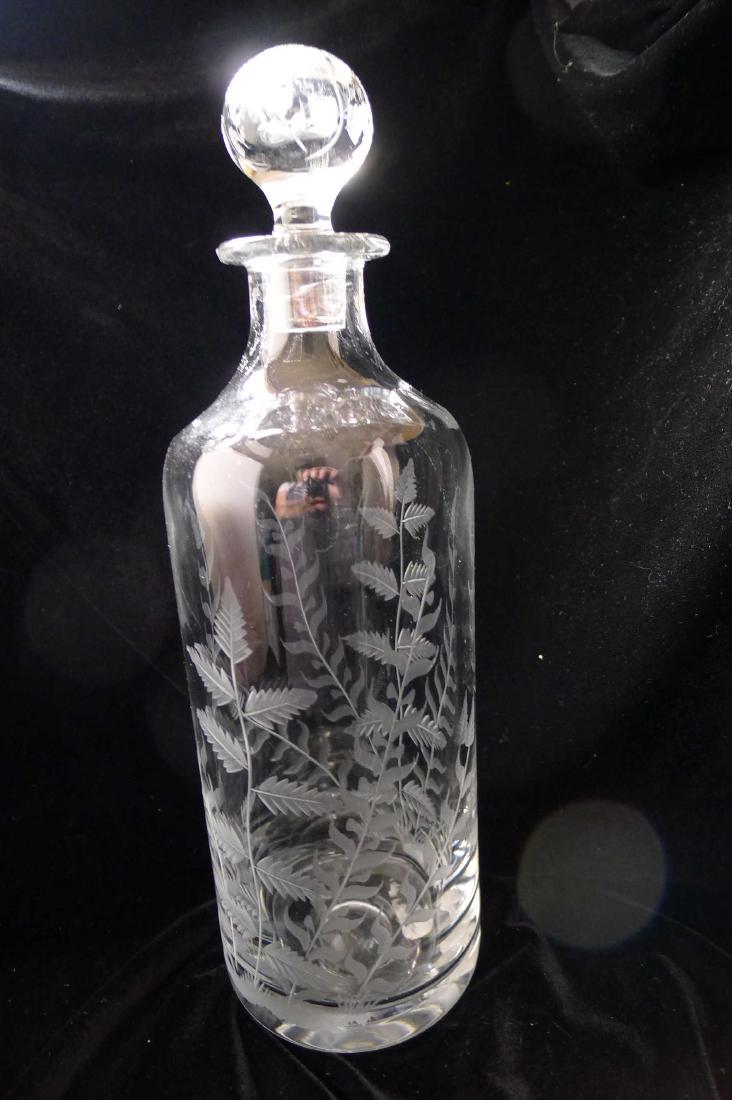 William Yeoward Crystal decanter: Title: William Yeoward Crystal decanter Date/Period: unknown Materials: glass crystal Dimensions: approx 11.5" tall and 3.5" at base Description: engraved with palm and leaf pattern Reserve: $200.00 S