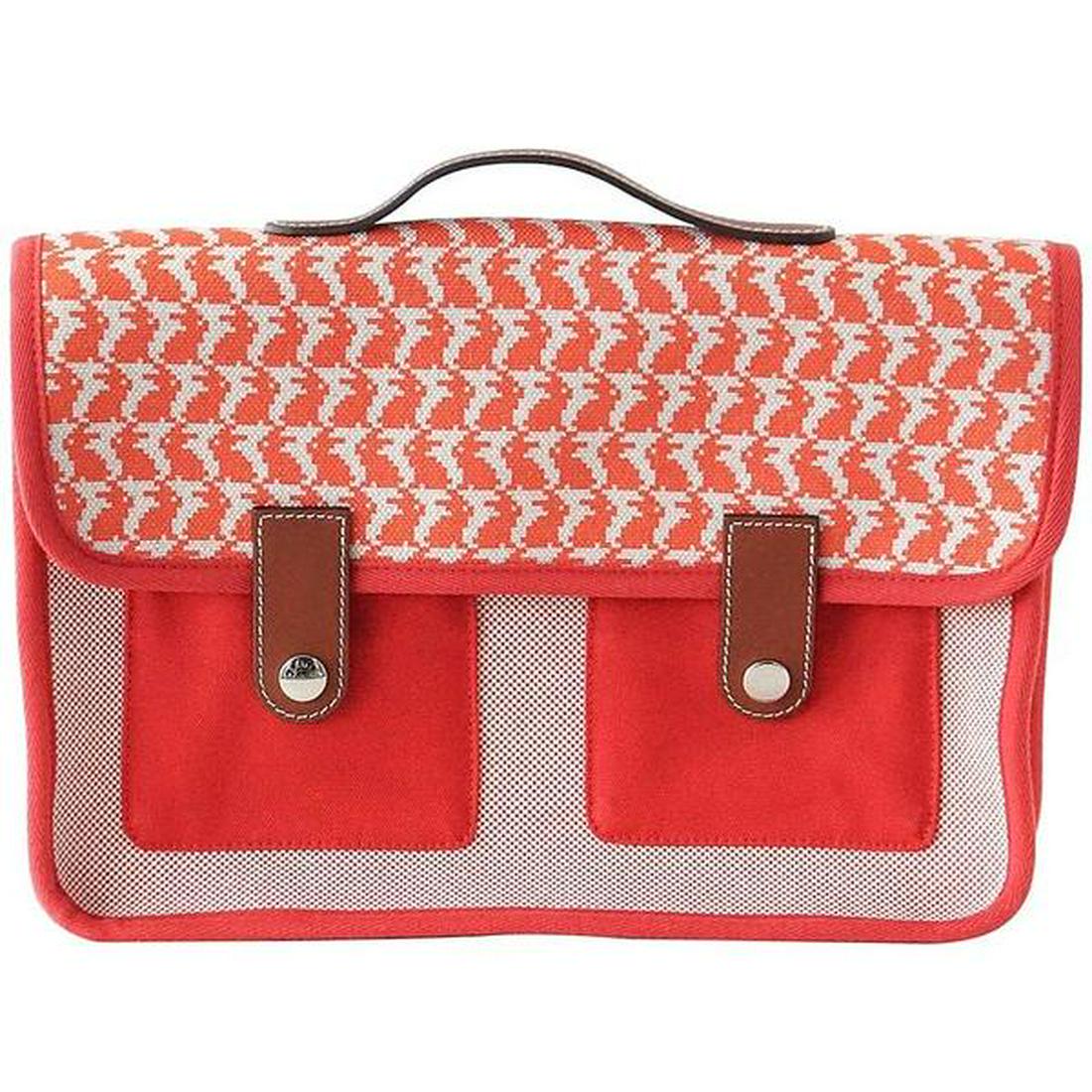 Hermes Bag Animaux Pixel Backpack Printed Red Canvas: Front flap has a pixelated Orange rabbit print and 2 front Barenia leather tabs with 2 clou de selle snaps. Bag has Barenia leather top handle and 2 red fabric straps. 2 Exterior red slot pockets unde