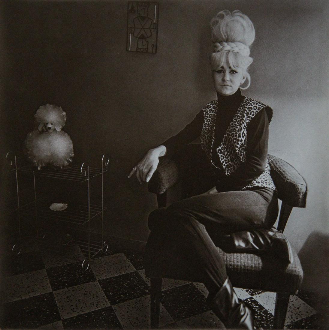 DIANE ARBUS - Lady Bartender with Souvenir Dog, 1964: Artist: Diane Arbus Title: Lady Bartender with Souvenir Dog, New Orleans, 1964 Medium: Photo Litho, 1972, USA Dimensions: 8.25x8.3" Heat Wax Mounted on 11x14" Conservation Board Diane Arbus was an Ame