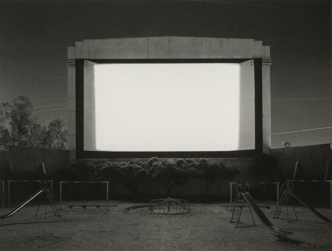 HIROSHI SUGIMOTO - Tri-City Drive-In, San Bernadino: Artist: Hiroshi Sugimoto Title: Tri-City Drive-In, San Bernadino, 1993 Medium: Photo Litho, 2005, Germany Dimensions: 8.5x6.4" Heat Wax Mounted on 11x14" Conservation Board Hiroshi Sugimoto (1948) is 