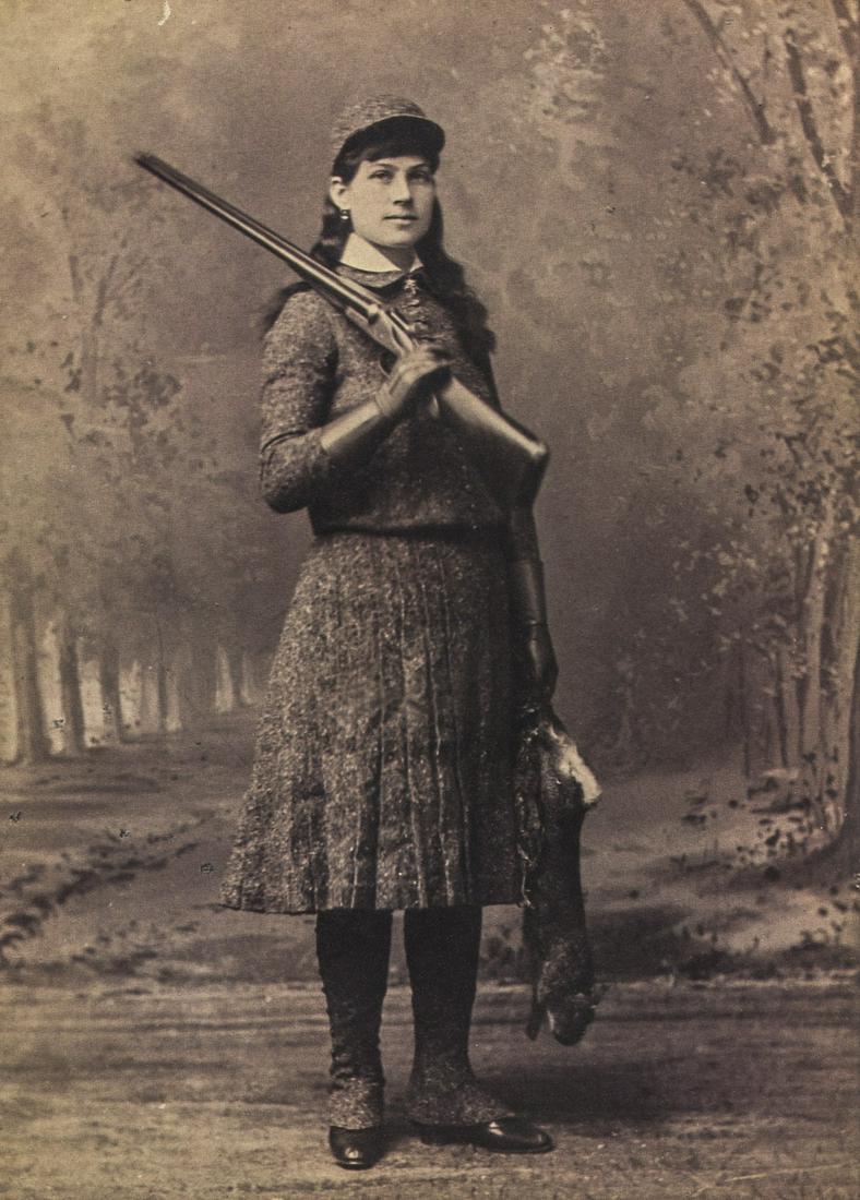 JOHN WOOD - Miss Annie Oakley (Little Sure Shot), 1880s: Artist: John Wood Title: Miss Annie Oakley (Little Sure Shot), 1880s Medium: Photo Litho, 1982, USA Dimensions: 7.1x9.9" Heat Wax Mounted on 12x16" Conservation Board Reserve: $45.00 Shipping: Domesti