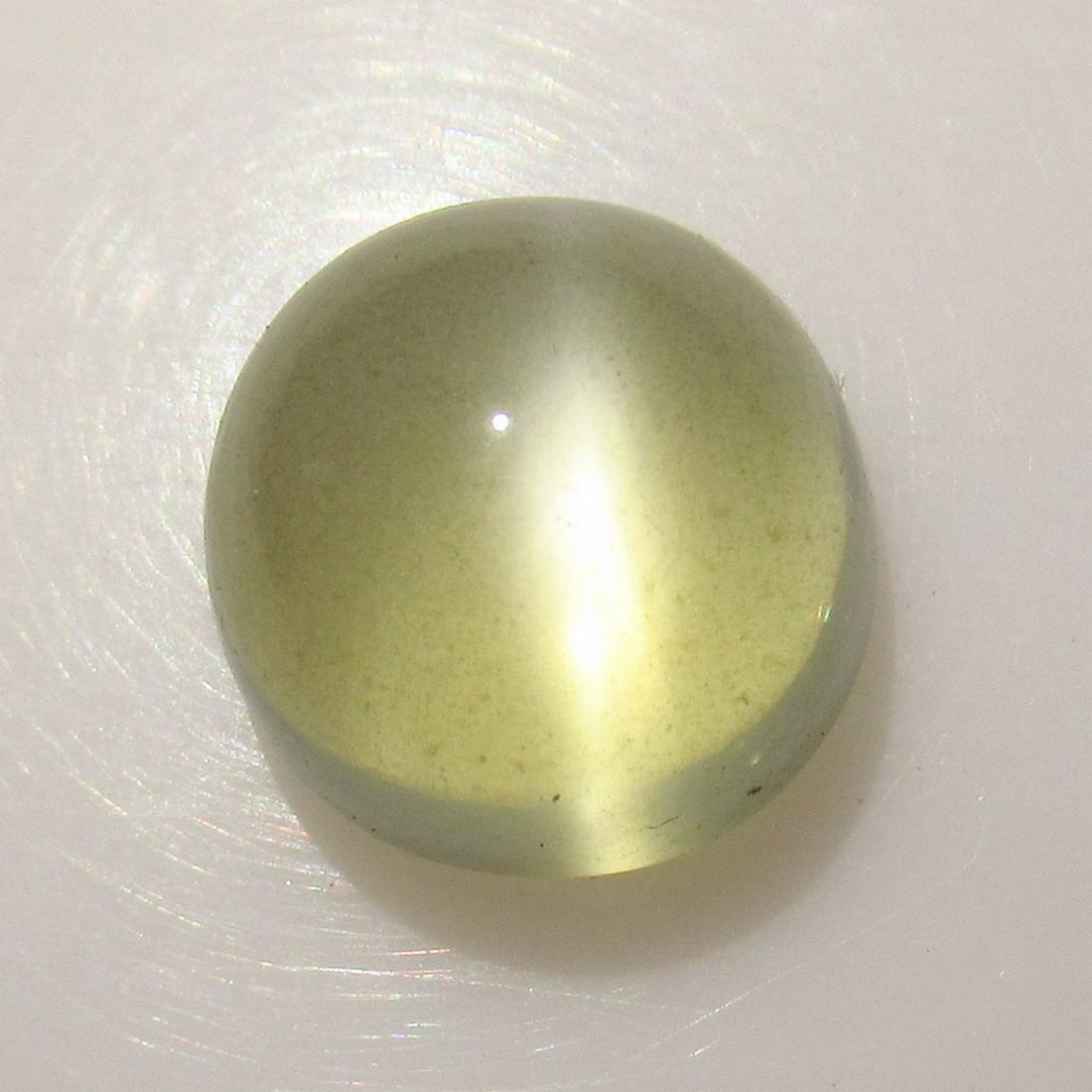 6.82 Ct Genuine White Moonstone Catseye 11 mm Round: No Reserve! Title: 6.82 Ct Genuine White Moonstone Catseye 11 mm Round Stone Clarity: Transparent Loose Gemstone: Natural Moonstone Catseye Carat Weights: 6.82 Size / Dimensions: 11.00 x 11.00 x 7.70 