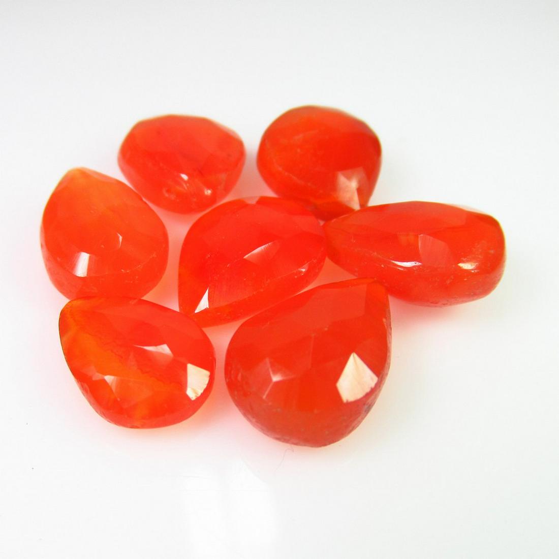 41.41 Ct Genuine 7 Carnelian Drilled Pear Beads: No Reserve! Title: 41.41 Ct Genuine 7 Carnelian Drilled Pear Beads Stone Clarity: Transparent Loose Gemstone: Natural Carnelian Beads Carat Weights: 41.41 Size / Dimensions: 13x11.5 to 14x11.5 mm / 7 