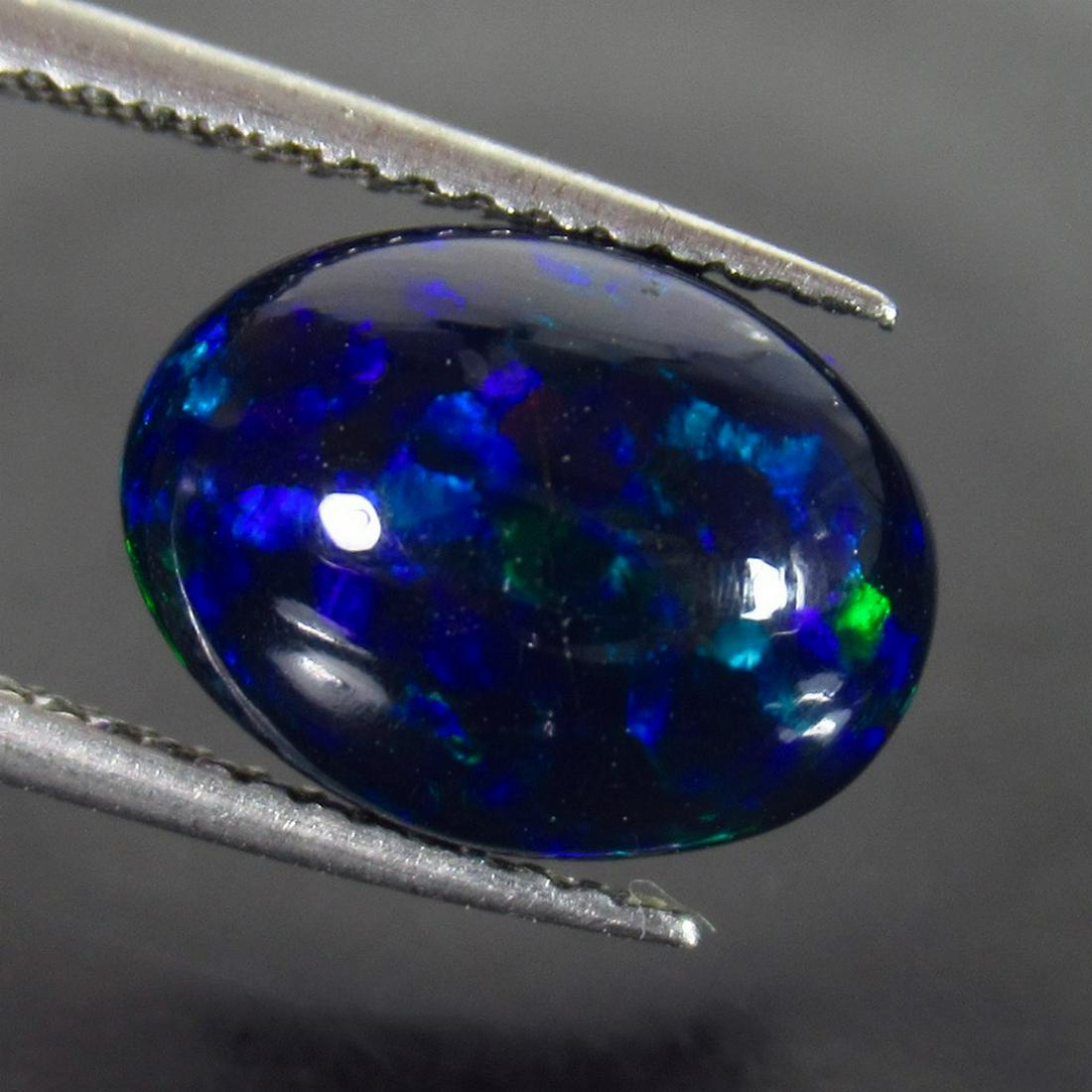 2.47 Ct Genuine Ethiopian Fire Black Opal Oval Cab (1 of 2)