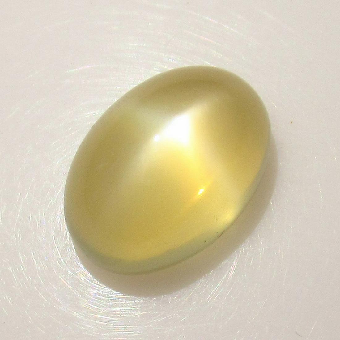 9.09 Ct Genuine Moonstone Catseye 14.5X10 mm Oval: No Reserve! Title: 9.09 Ct Genuine Moonstone Catseye 14.5X10 mm Oval Stone Clarity: Transparent Loose Gemstone: Natural Moonstone Catseye Carat Weights: 9.09 Size / Dimensions: 14.40 x 10.00 x 8.60 mm