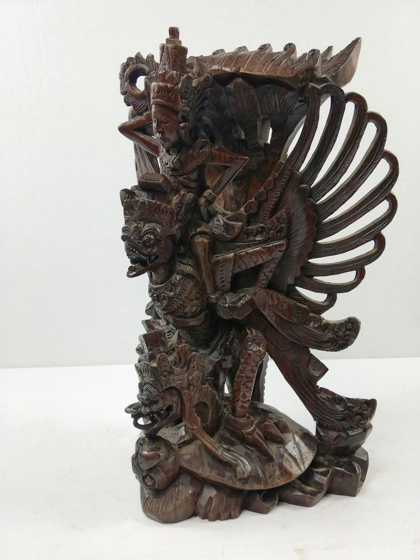 Vishnu on Garuda: Title: Vishnu on Garuda Maker: Local artist Origin: Indonesia Date: 1960's Material: Wood Size: Height: 39 cm / 16 inch, Width: 27 cm / 10.8 inch, Depth: 13 cm / 5.2 inch Very detailed sculpt