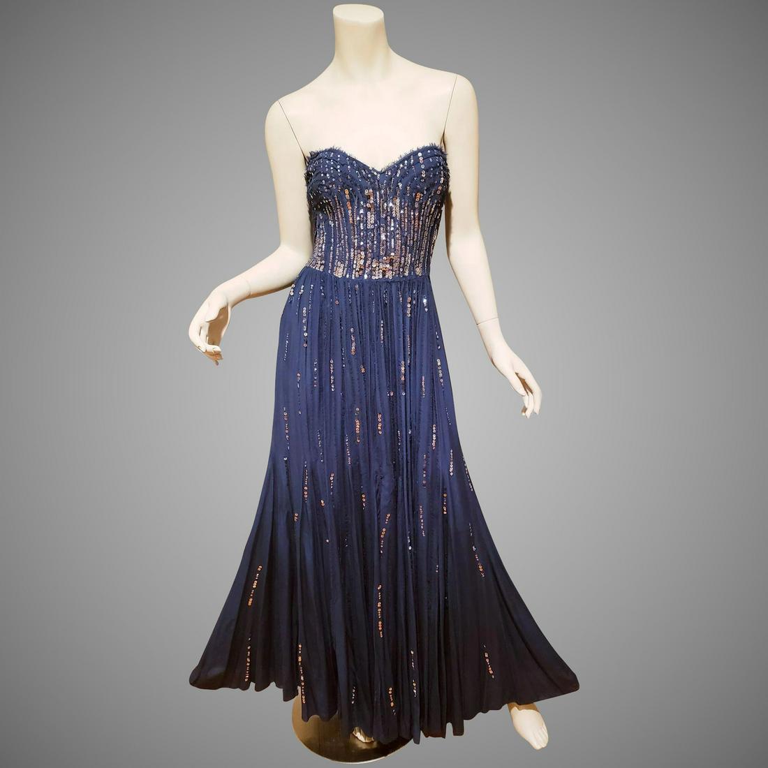 Rebecca Taylor blue Meteor shower embellished silk gown: This is an amazing fluid blue meteor gown by famous Rebecca Taylor. Strapless with great details and Meteor shower like sequins design.. A True beauty, the back is a bit elasticized so its very roomy.