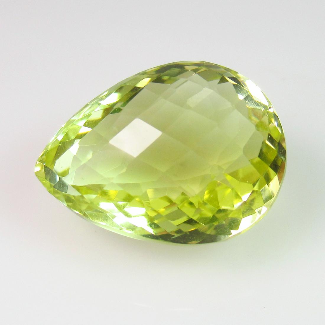 16.31 Ct Natural Lemon Quartz Pear Checkerboard Cut: No Reserve! Title: 16.31 Ct Natural Lemon Quartz Pear Checkerboard Cut Stone Clarity: VVS Gemstones: Natuarl Lemon Quartz Carat Weights: 16.31 Size/Dimensions: 18.80 x 14.10 x 10.70 mm Additional Info