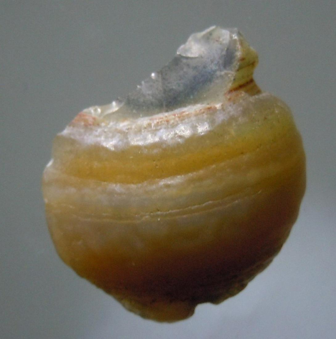 EYE AGATE - 100 % NATURAL: Title: EYE AGATE - 100 % NATURAL Origin: Alashan Area, Gobi Desert, Inner Mongolia, China Size: 2.1x1.7x0.6 cm / 3 gram Description: eye agate slize Reserve: $2.00 Shipping: Domestic: Flat-rate of $6.