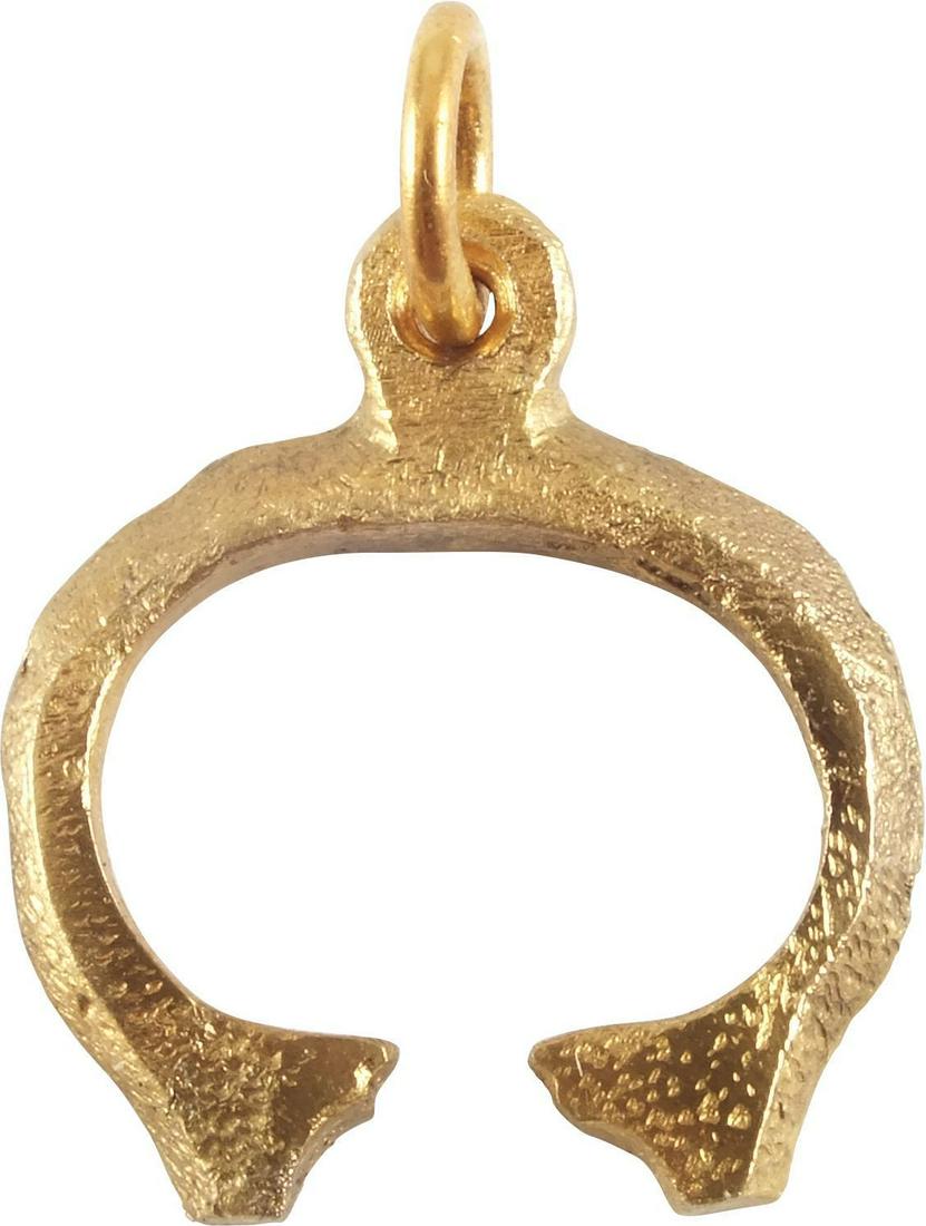 VIKING LUNAR/ASTROLOGICAL PENDANT 9th-10th CENTURY: Gilt bronze. As expert navigators, the constellations signified mystery and power to Vikings. The Moon was personified as Mani, brother to Sol the Sun, and is abundantly represented in Norse literatur