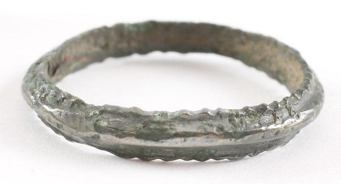 VIKING WEDDING RING, 850-1050 AD, Sz 6 1/4: No Reserve! Bronze size 6 ¼. Medium width with raised medail The inside with tool wok and evidence of having been cast with a center core, removed in the finishing process. Rich glossy patina. Viking