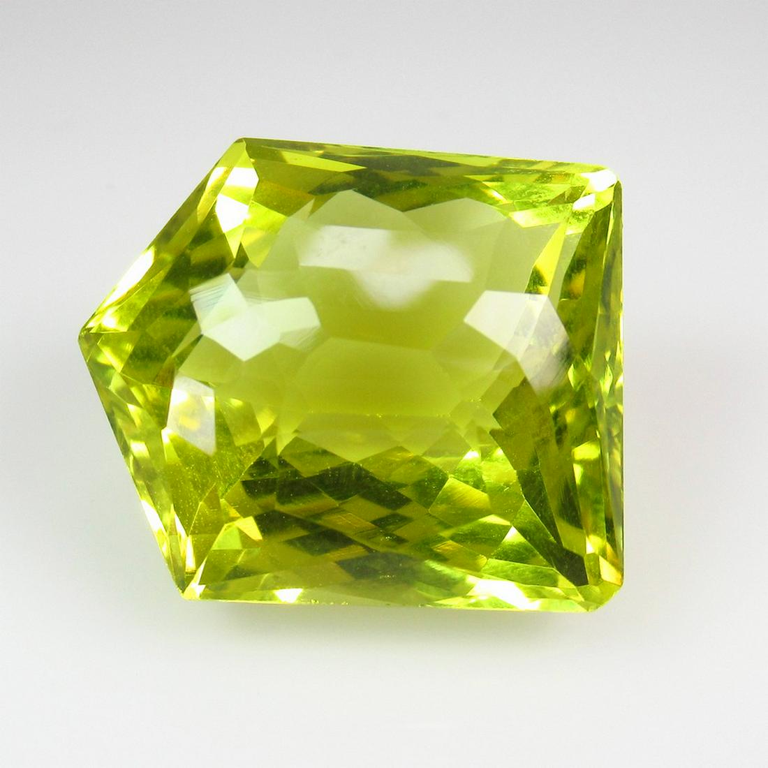 34.28 Ctw Natural Lemon Quartz 21X18 mm Fancy Cut: Title: 34.28 Ctw Natural Lemon Quartz 21X18 mm Fancy Cut Stone Clarity: VVS Gemstones: Lemon Quartz Carat Weights: 34.28 Size/Dimensions: 21.00 x 18.00 x 14.00 mm Additional Information: Good Luster /