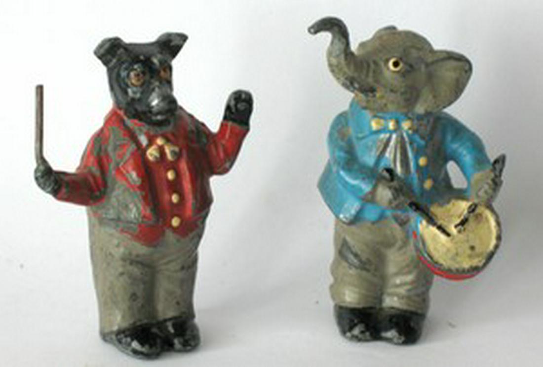 Pair Of Cast Metal Figures: Title: Pair Of Cast Metal Figures Date/Period: 1930's or earlier Dimension: 3” tall Provenance:A whimsical pair of cast metal figures, a bear band leader & an elephant playing a drum. Both in origin