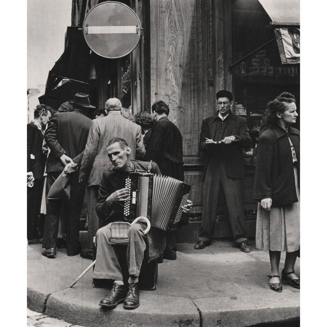ROBERT DOISNEAU - Concertina Player in the Rue: Artist: ROBERT DOISNEAU Print Title: Concertina Player in the Rue Mouffetard, 1951 Medium: Sheet-fed Gravure Printing Date: 1970's Printed in France Image Size: 6.75 x 8 inches Robert Doisneau (1912-1