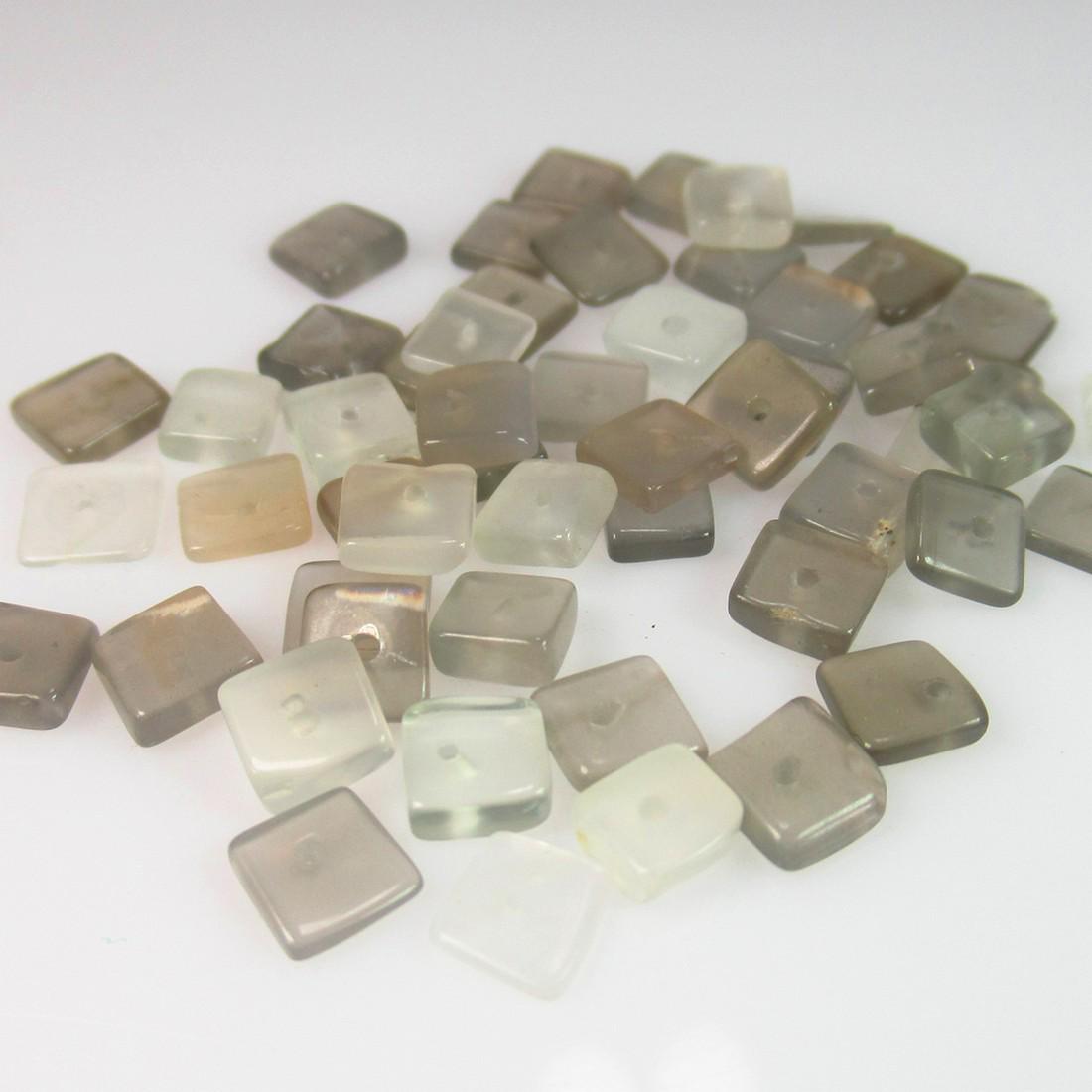 17.68 Ct Genuine 53 Drilled Moonstone Square Beads: No Reserve! Title: 17.68 Ct Genuine 53 Drilled Moonstone Square Beads Stone Clarity: Semi-Transparent Gemstones: Natural Moonstone Beads Carat Weights: 17.68 Size/Dimensions: 4.5x4.5 to 4.8x4.8 mm / 5