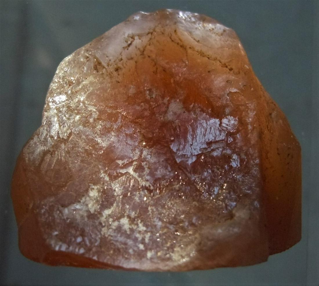 105.05 CT SPARKLING RED-BROWN SUNSTONE: Title: 105.05 CT SPARKLING RED-BROWN SUNSTONE Origin: Ankaratra Mts. Antananarivo Prov. Madagascar Size: 3.2x2.9x2.2 cm / 21 gram Description: sparkling, red brown sunstone Reserve: $6.00 Shipping: Do