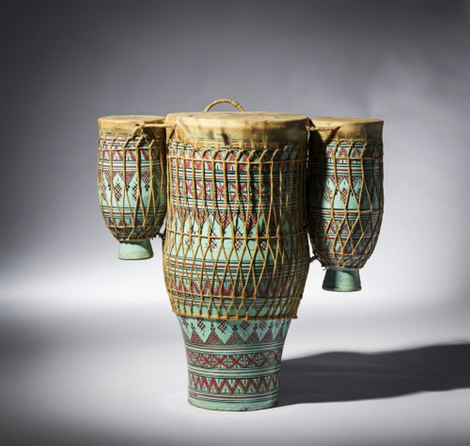 Triple porcelain Timbla drum, Moroccan: Title: Triple porcelain Timbla drum, Moroccan Date/Period: 20th C Material: wood, leather, pigments and fiber Dimension: 51.5 (W) cm Provenance:Rare, exquisite and beautiful. Porcelain with polychrome