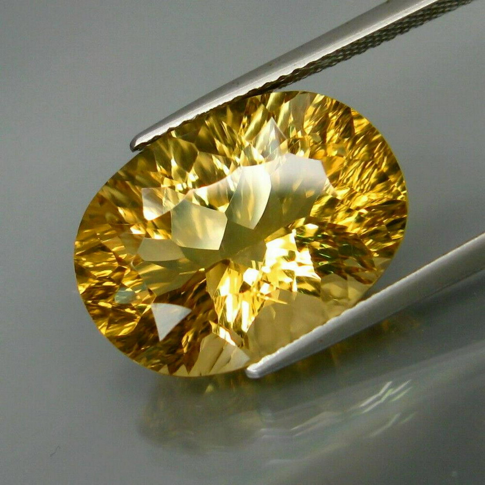 12 ct natural concave lemon qurtz: No Reserve! Title: 12 ct natural concave lemon qurtz Color/Clarity: yellow/clean Gemstone Type: natural/untreated Carat Weights: 12 Size/Dimensions: 18x13x9 Shipping: Domestic: Flat-rate of $10.00 to 