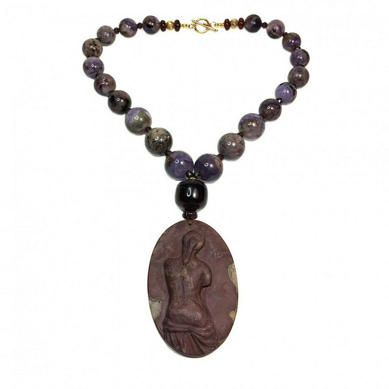 Charoite Russia Necklace with Cameo Pendant: Materials, Chariot Russia, Garnet, Amber This Chariot Russia necklace created by Daisy Godwin with 16-21mm Charoite Russia beads, faceted Garnet and 3.25 x 2.125 x 0.375 inches Ribbon Jasper cameo pen