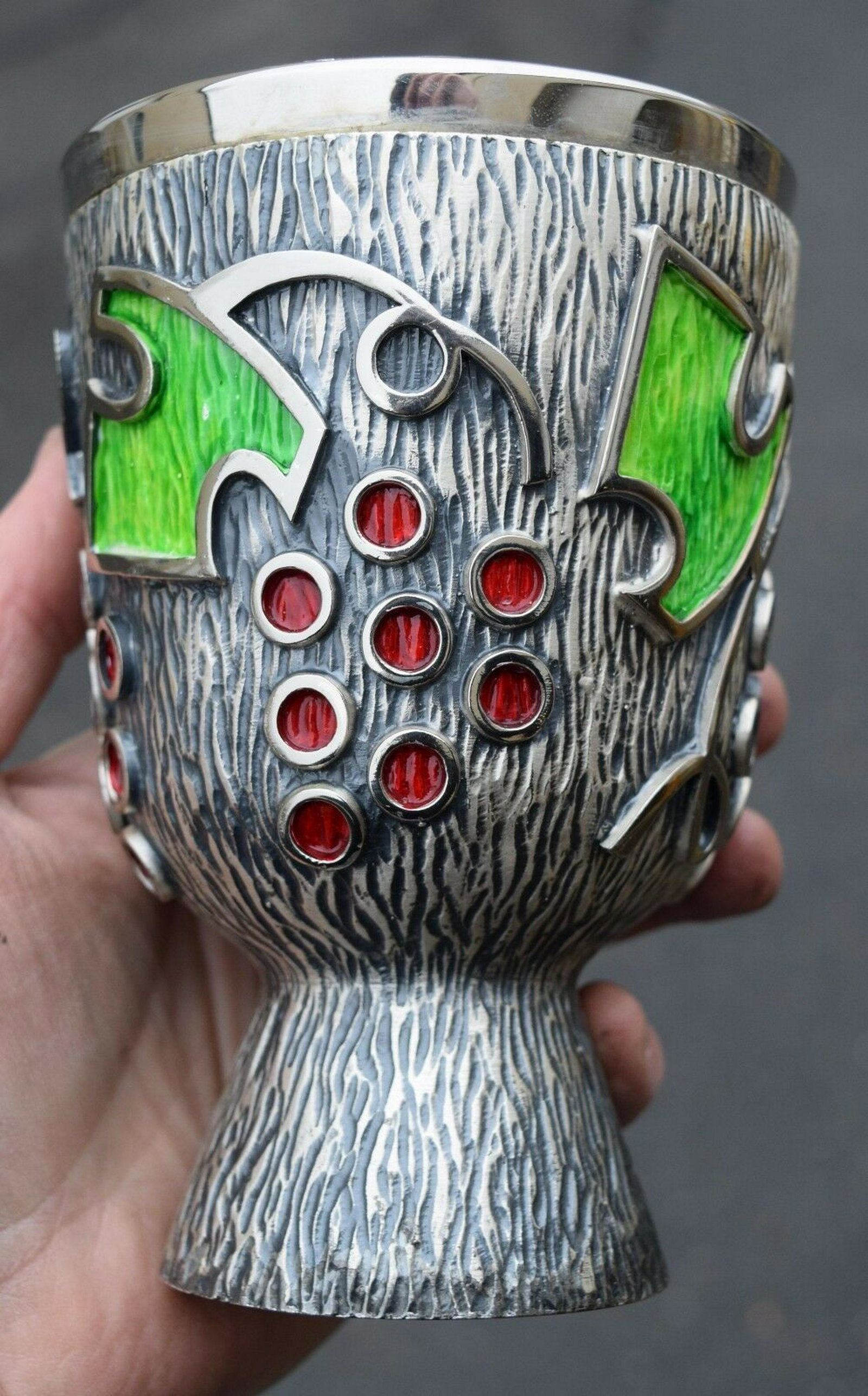 Nice Older Chalice with Grapes and Vines + (CU#563): Nice Older Chalice Colorful Grapes and Vine Motif around cup Tree Bark Finish Measures 6 1/4" tall 4 1/4" cup diameter A nice used church item No memorials Reserve: $224.00 Shipping: Domes