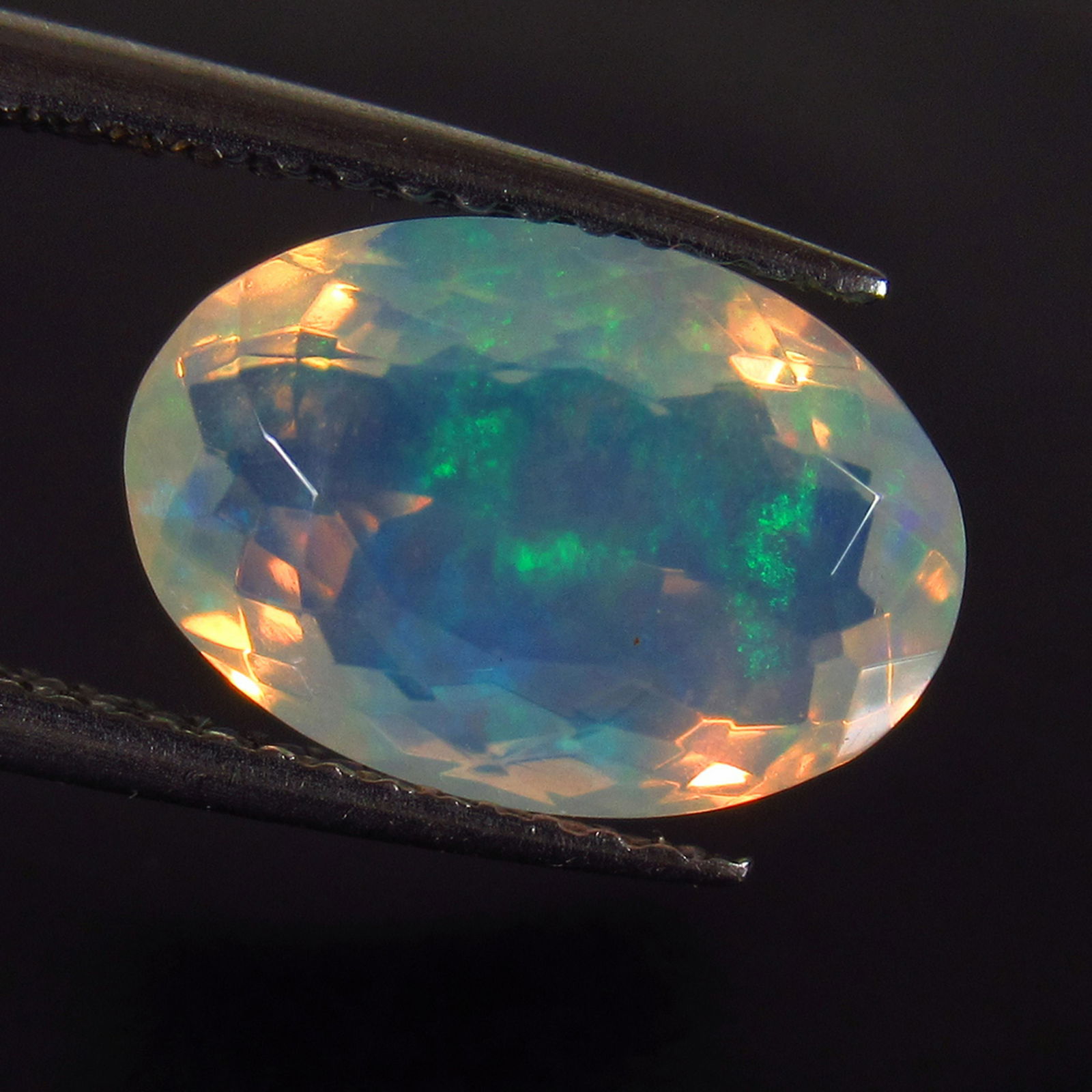 2.48 Ct Genuine Multi-Color Fire Faceted Opal Oval Cut (1 of 2)