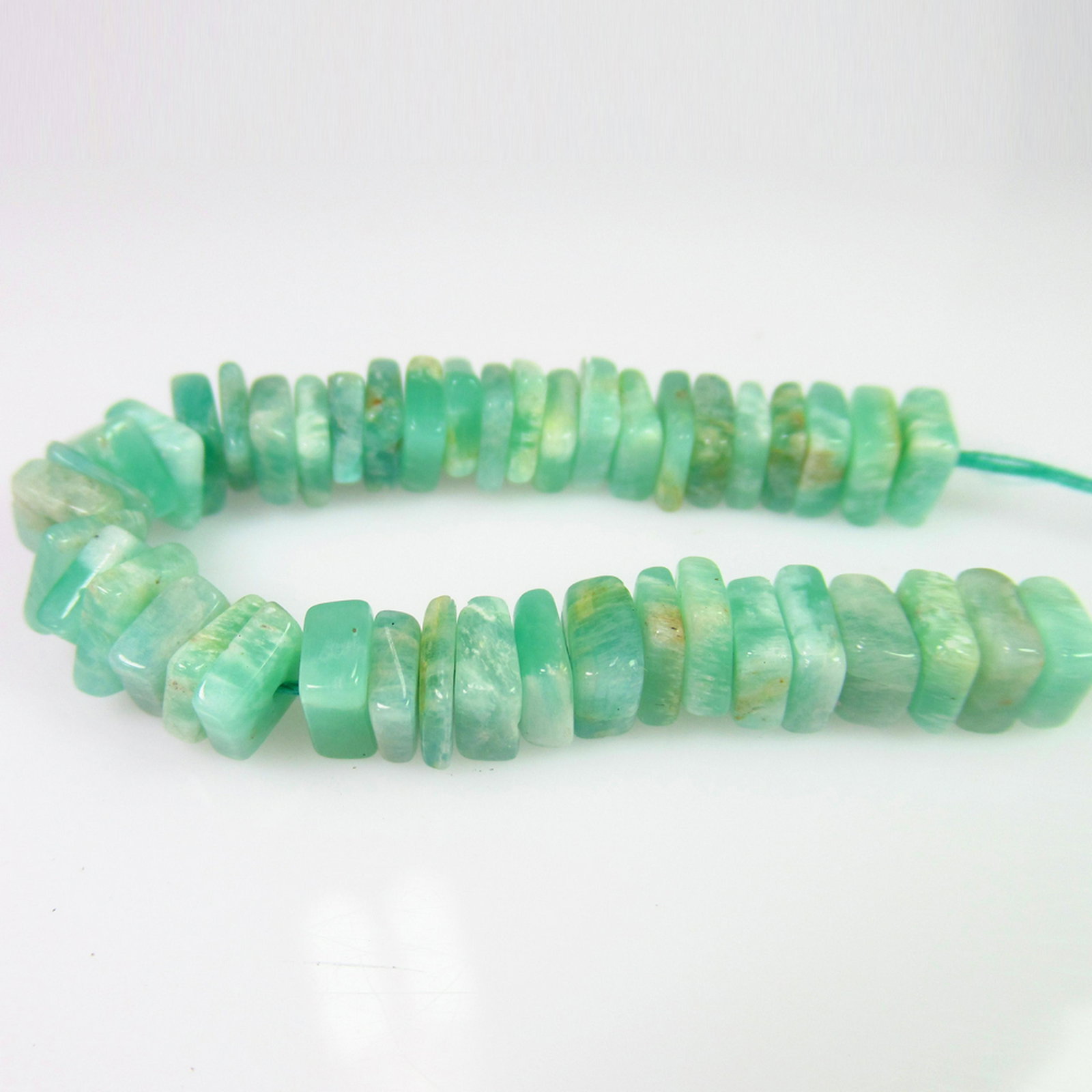 22.41 Ct Genuine 44 Drilled Amazonite Square Flat Beads: No Reserve! Title: 22.41 Ct Genuine 44 Drilled Amazonite Square Flat Beads Stone Clarity: Transparent Gemstones: Natural Amazonite Beads Carat Weights: 22.41 Size/Dimensions: 5.0x5.0 to 5.3x5.3 mm / 4
