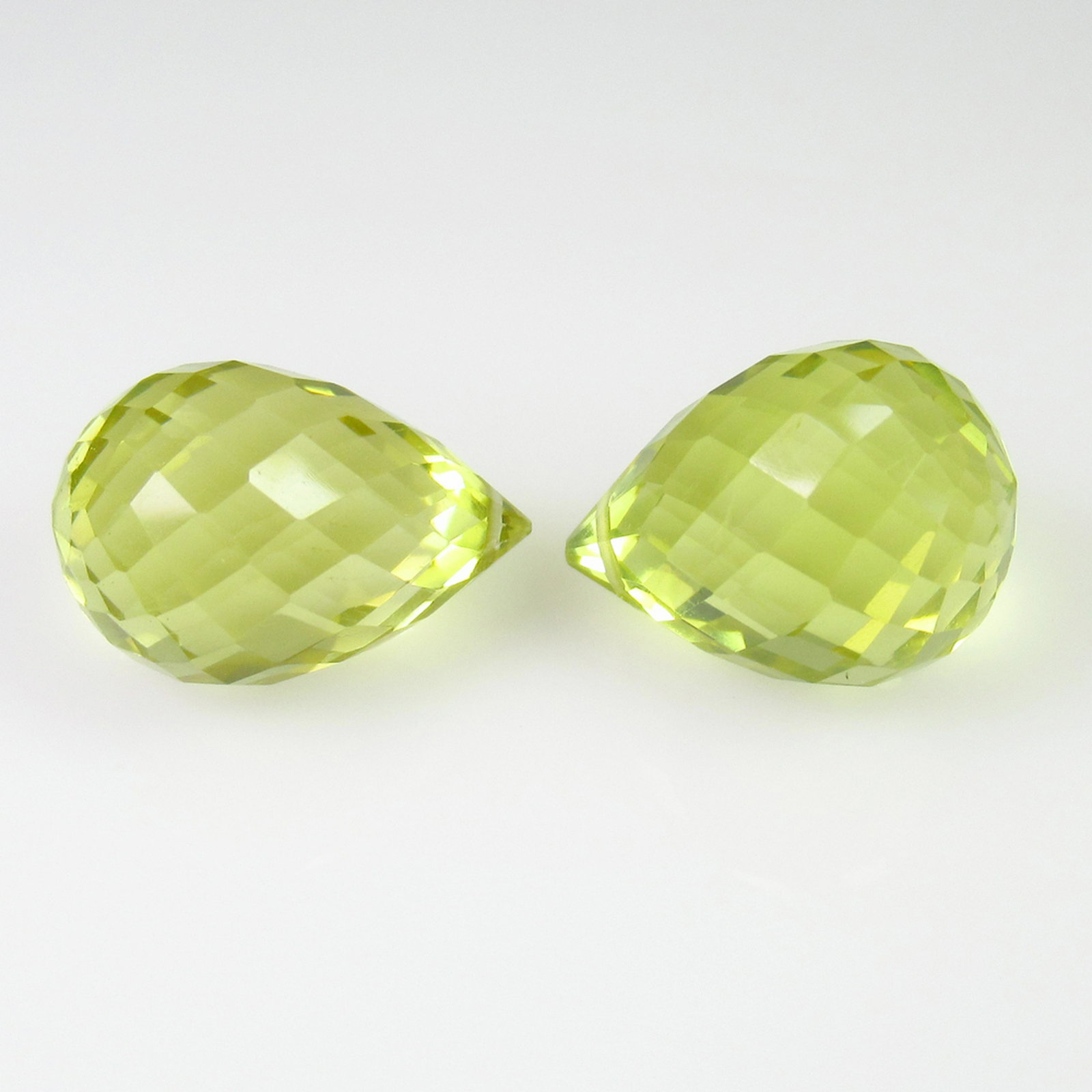 13.05 Ct Natural Drilled Lemon Quartz Briolette Beads: No Reserve! Title: 13.05 Ct Natural Drilled Lemon Quartz Briolette Beads Pair Stone Clarity: Transparent Gemstones: Natuarl Lemon Quartz Beads Carat Weights: 13.05 Size/Dimensions: 12.60 x 9.70 x 9.70