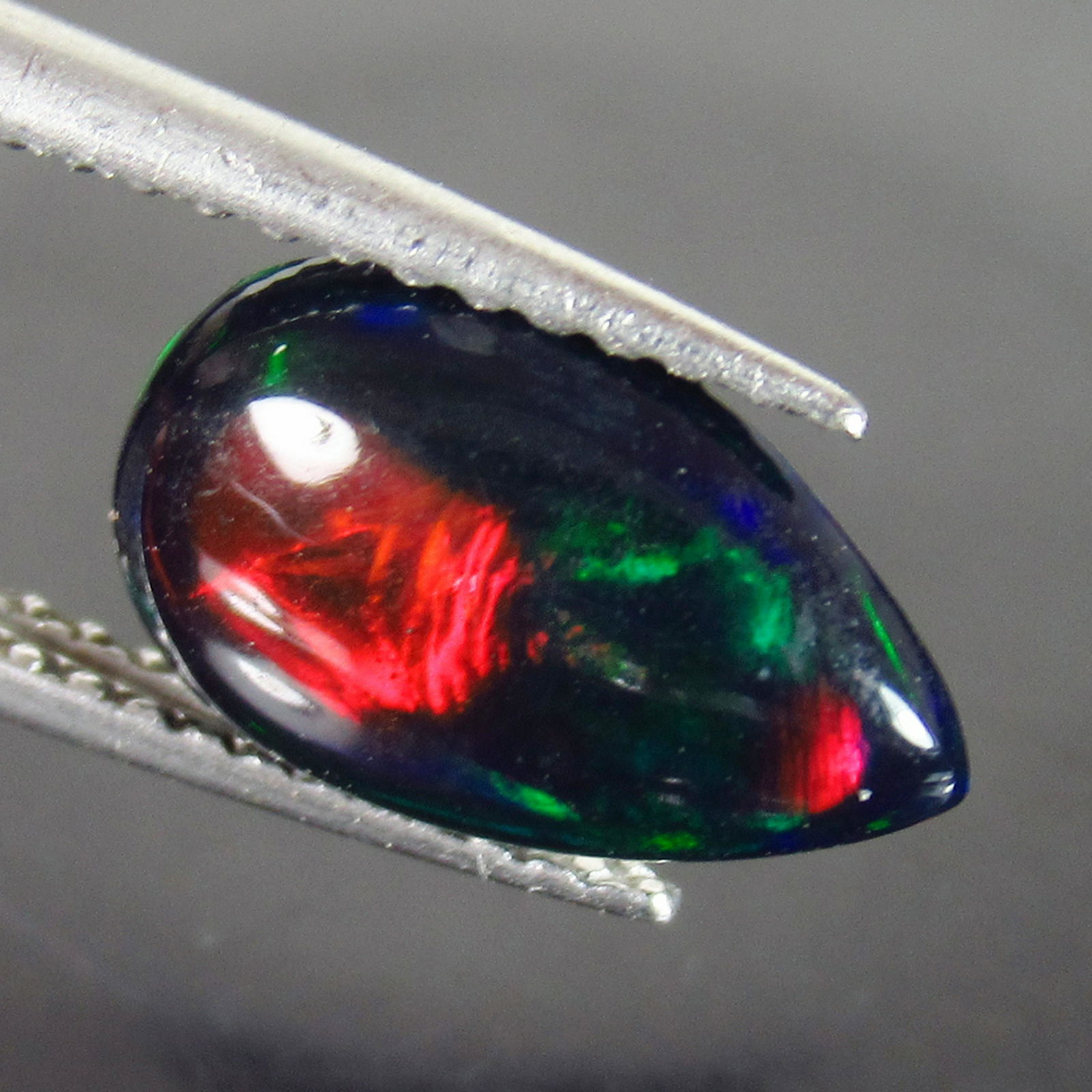 1.10 Ct Genuine Ethiopian Fire Black Opal Pear Cab (1 of 2)
