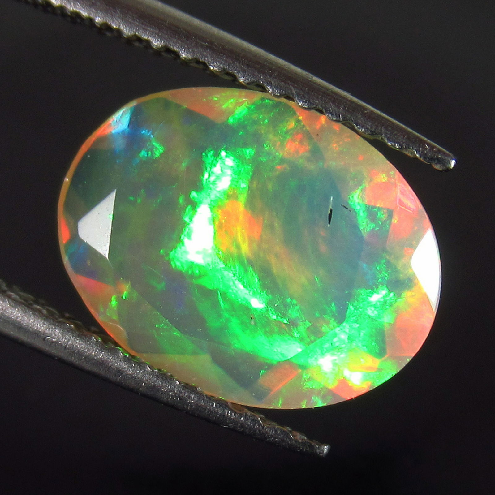 1.40 Ct Genuine Multi-Color Fire Faceted Opal Oval Cut (1 of 2)