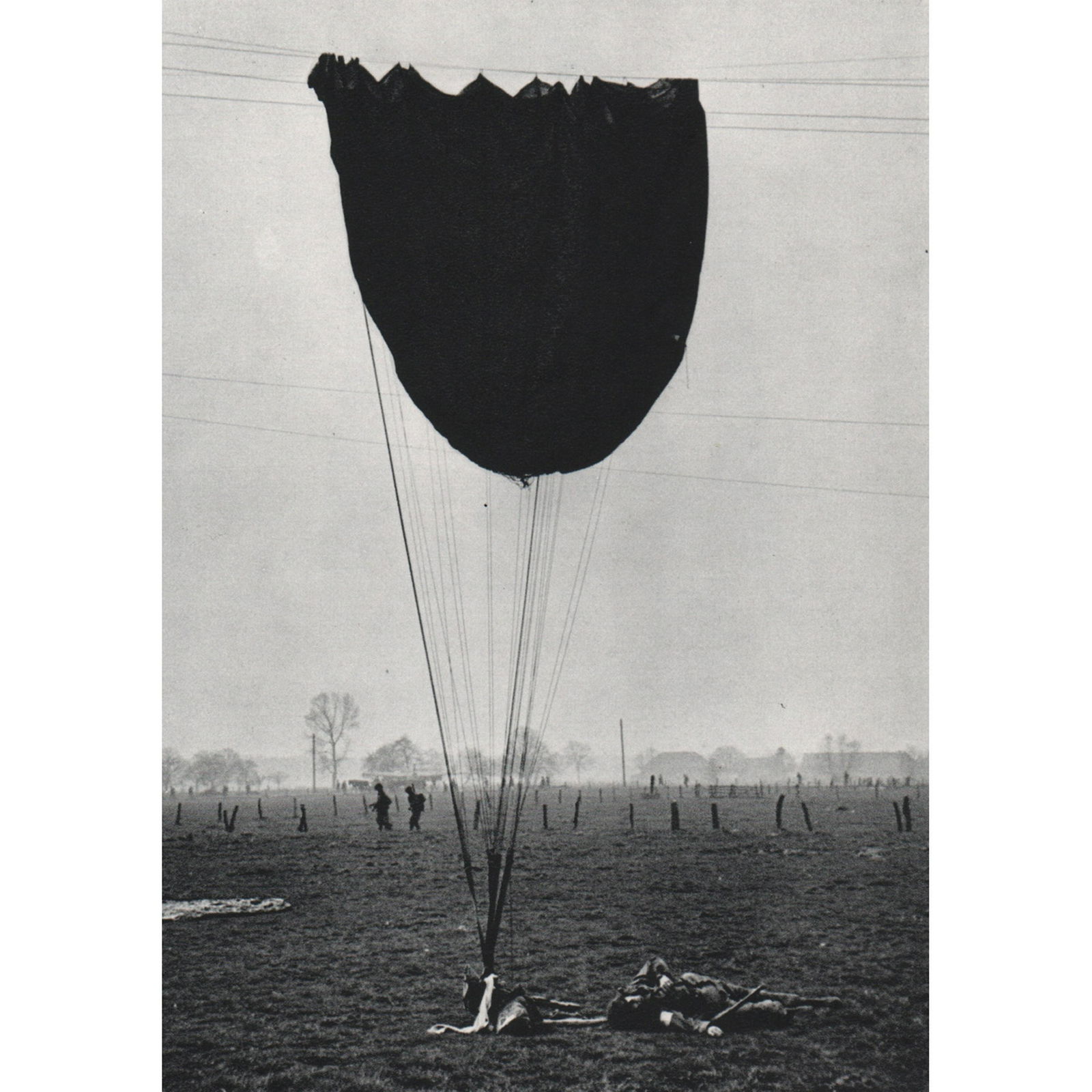 ROBERT CAPA - American Paratroopers, Germany 1945: Artist: ROBERT CAPA Print Title: American Paratroopers, Germany 1945 Medium: Sheet-fed Gravure Printing Date: 1970's Printed in Switzerland Image Size approx: 4.75 x 6.5 inches Robert Capa (1913-1954)