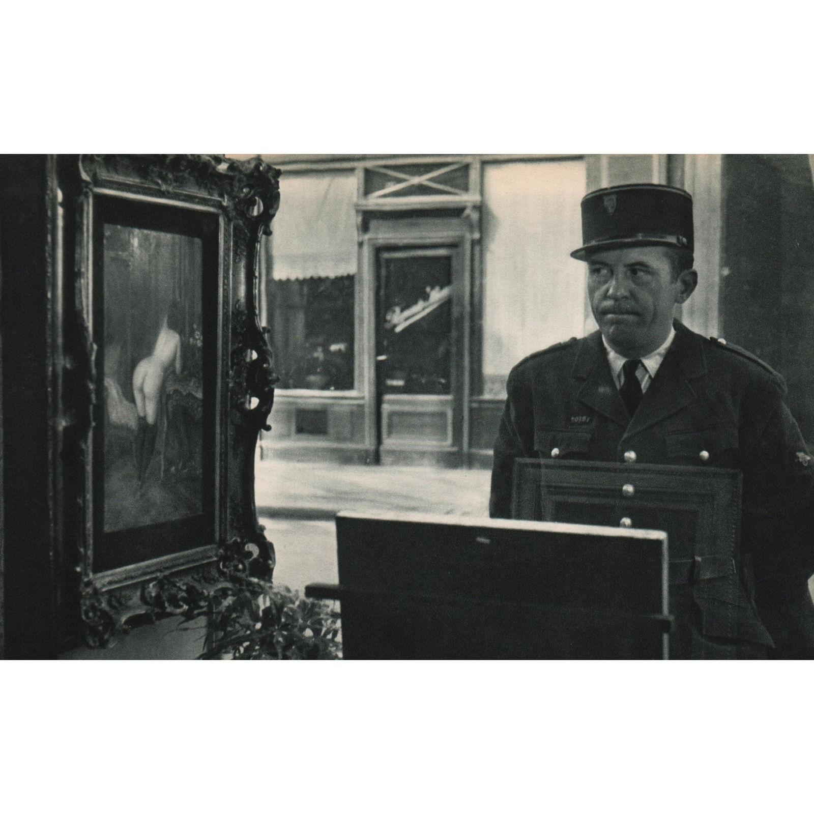 ROBERT DOISNEAU - The Romi Gallery, Paris: Artist: ROBERT DOISNEAU Print Title: The Romi Gallery, Paris Medium: Sheet-fed Gravure Printing Date: 1950's Printed in France Image Size approx: 8.5 x 5 inches Robert Doisneau (1912-1994) was a Frenc